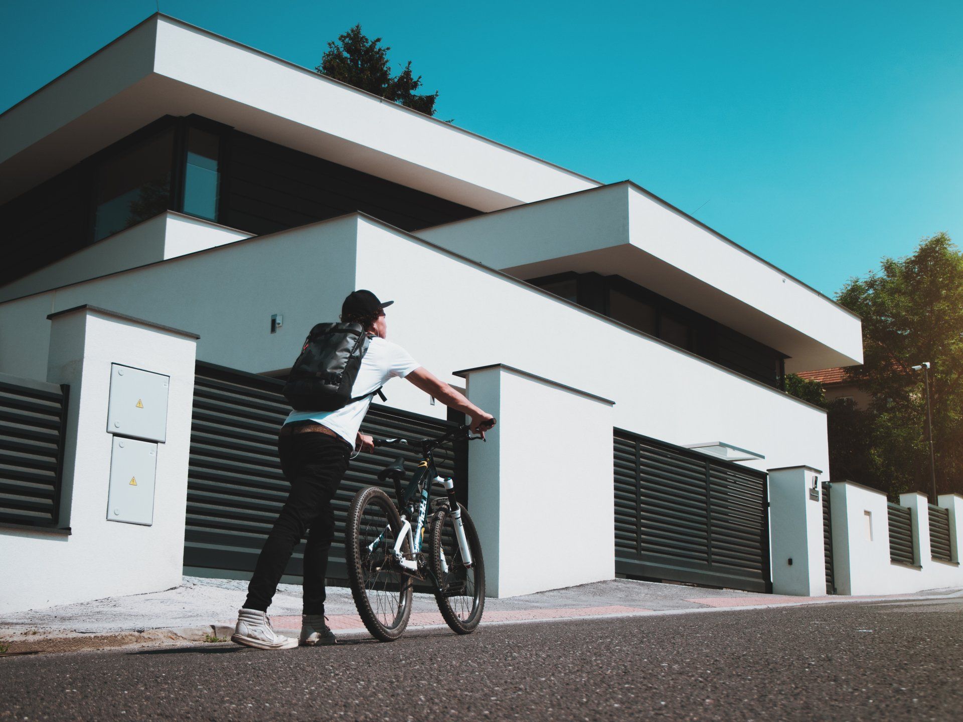 A man pushing a bicycle in front of the