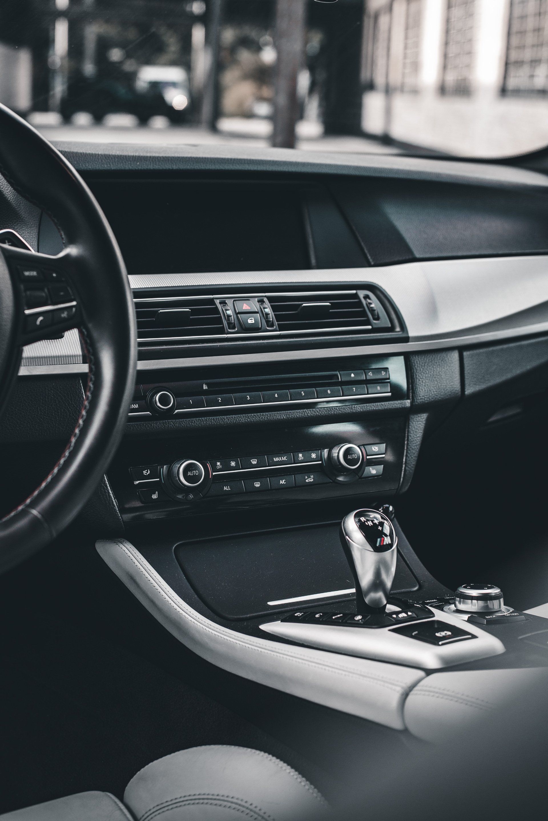 A black and white photo of the interior of a car.