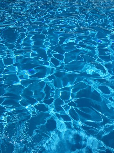 A close up of a swimming pool with blue water