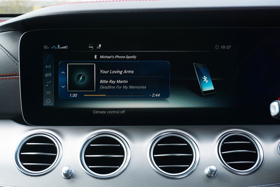 a car dashboard with a touchscreen display and air vents .