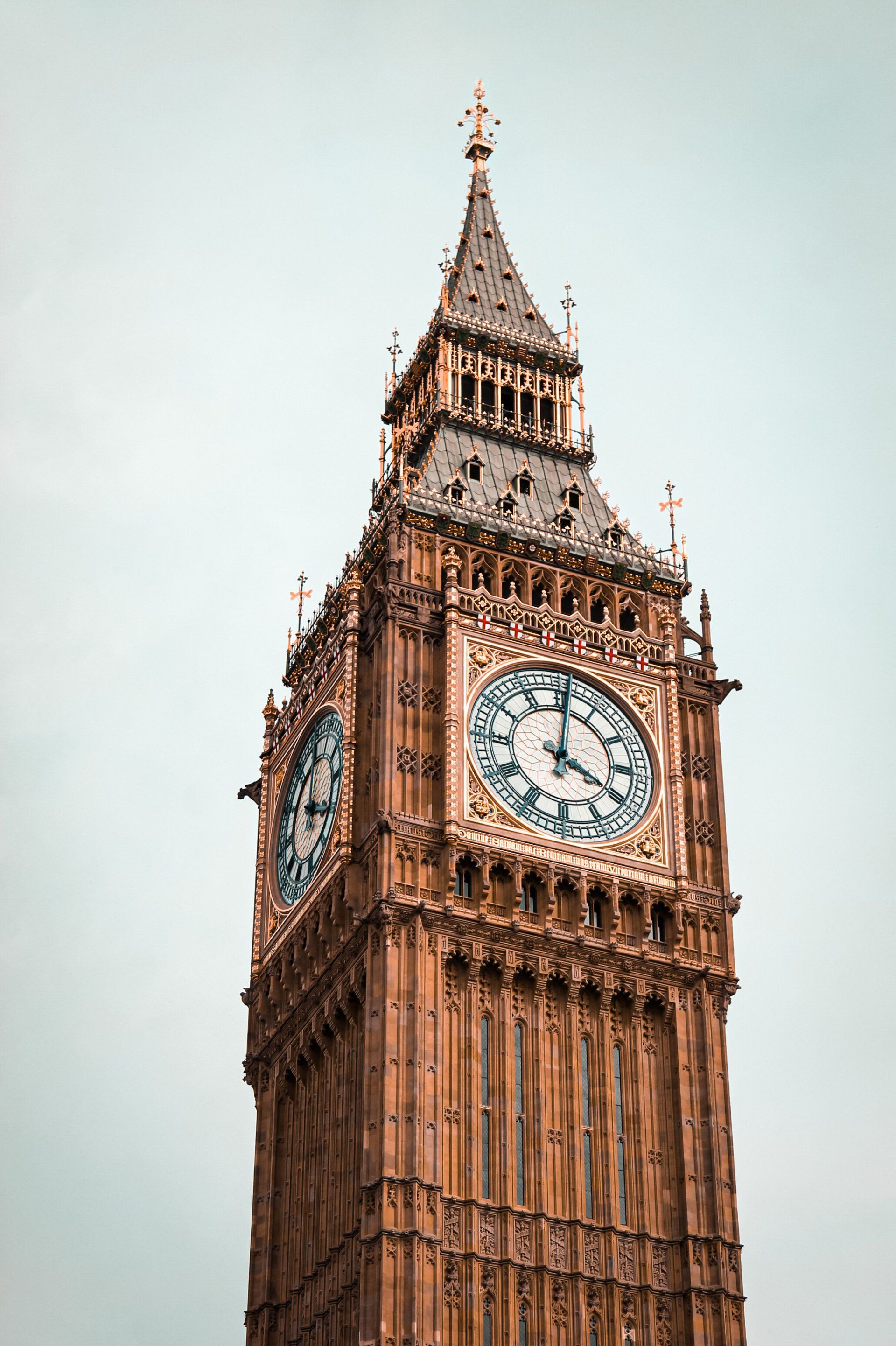 The big ben clock tower in london is a very tall building with a clock on it.