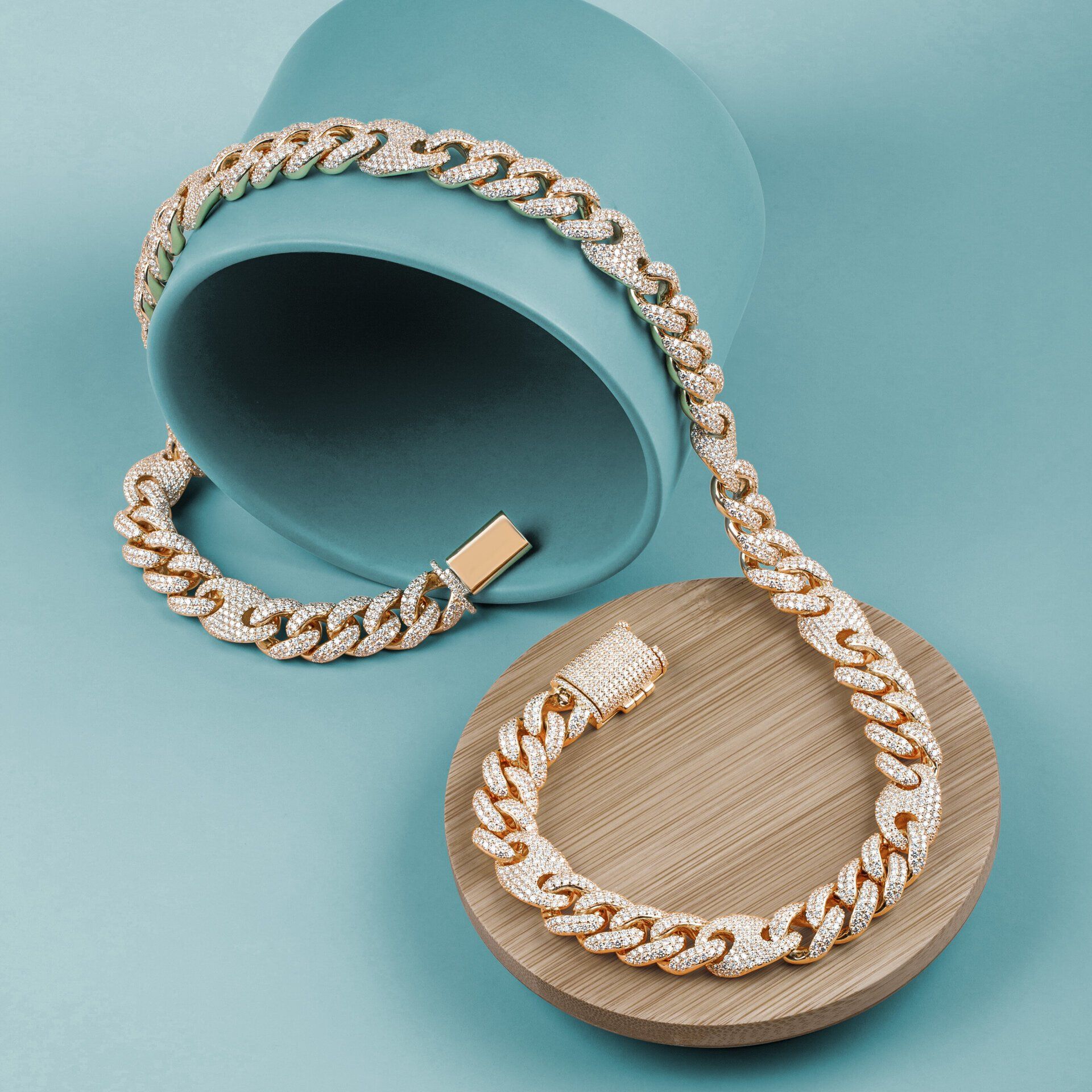 A necklace and bracelet are sitting on a wooden circle.