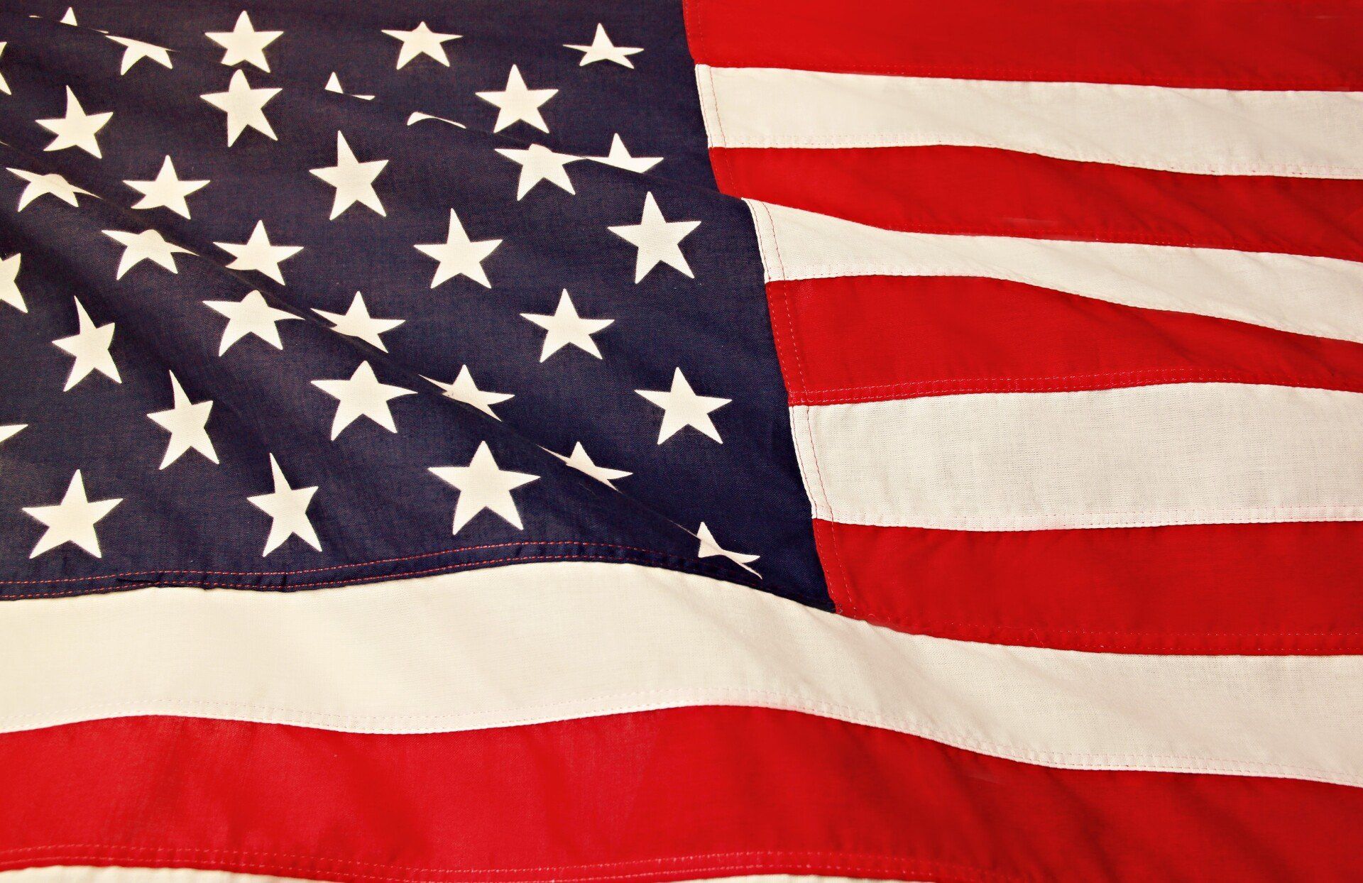 A close up of an american flag with stars and stripes
