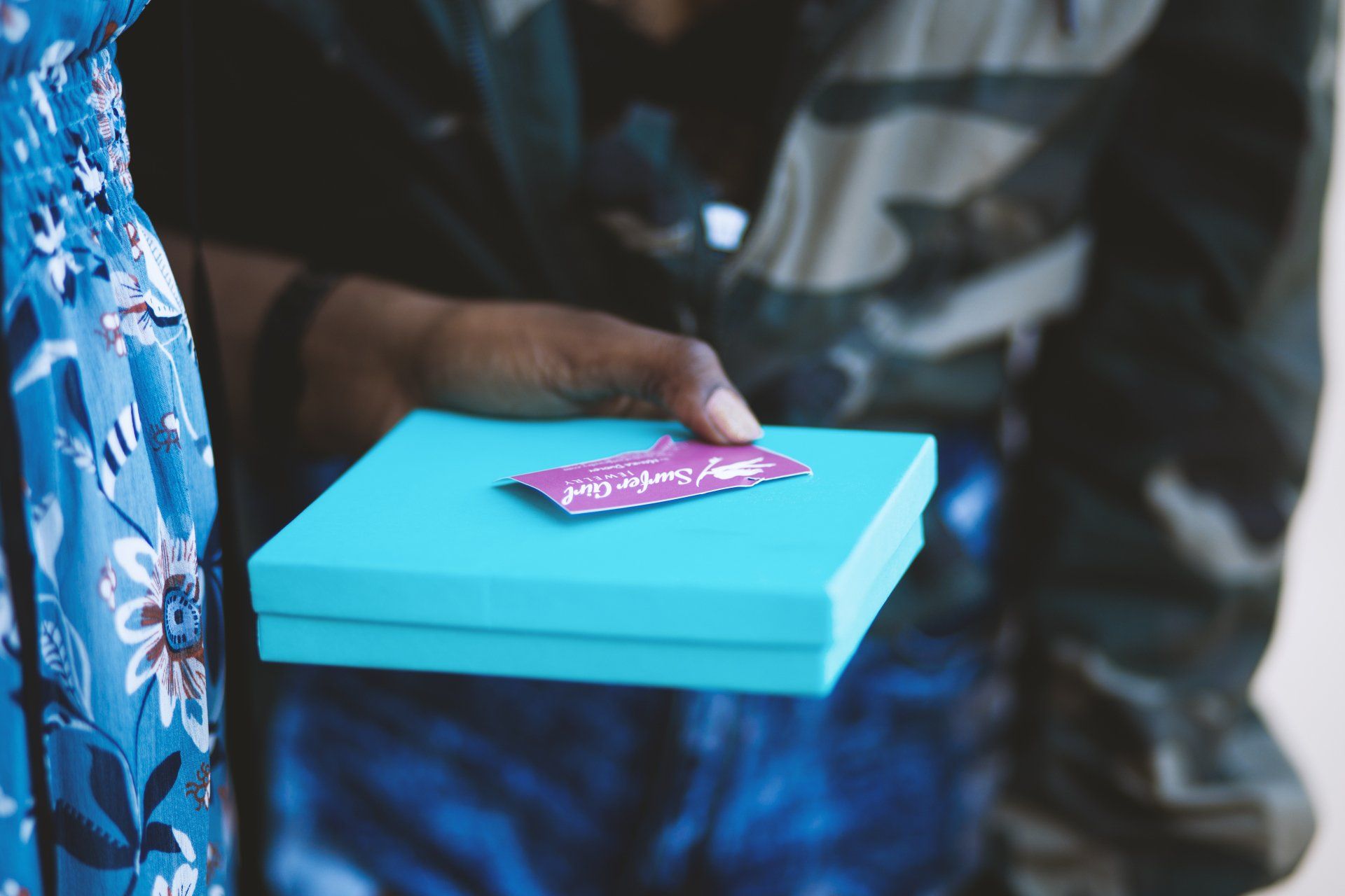 someone holding bright blue book