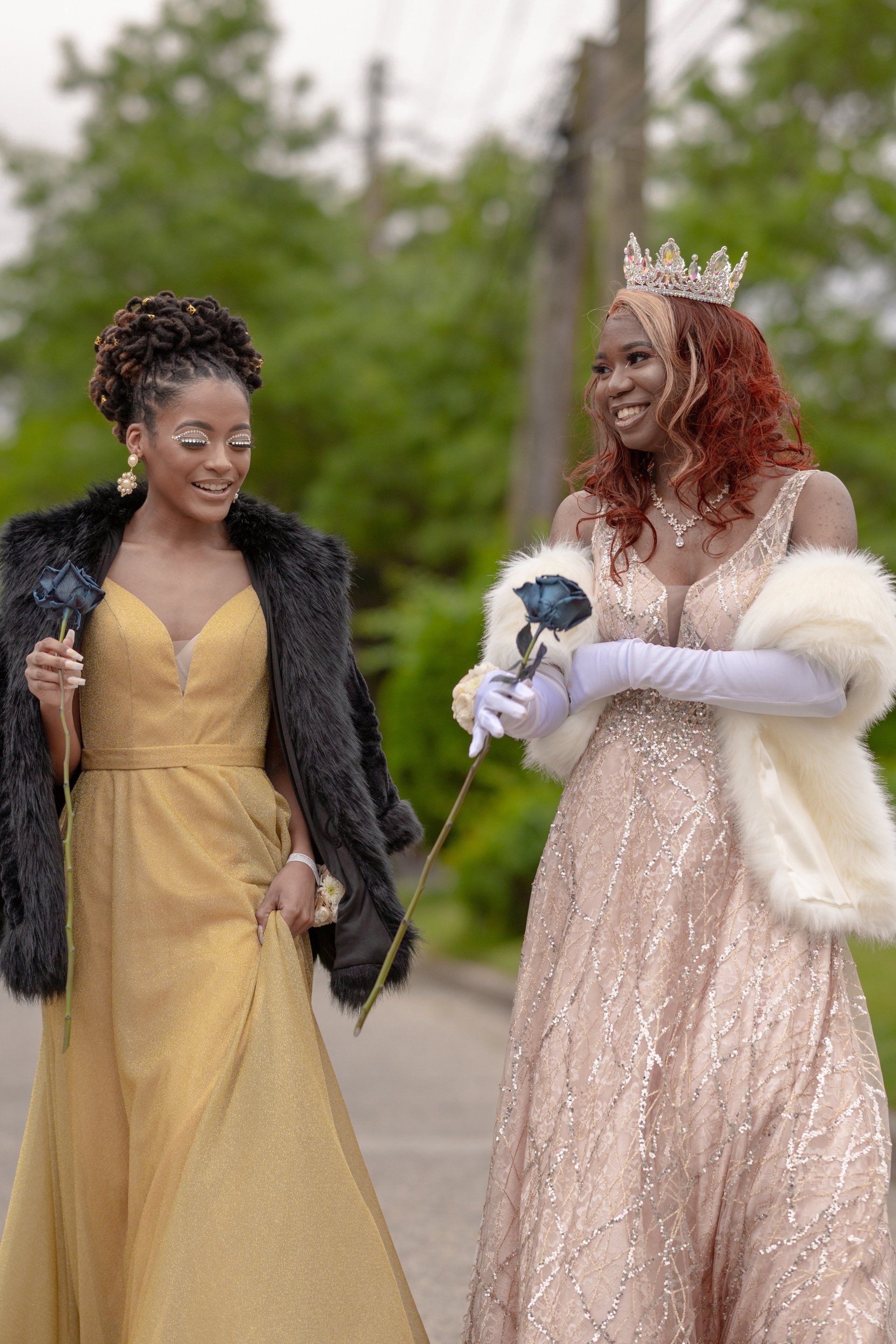 Two black women wearing gowns