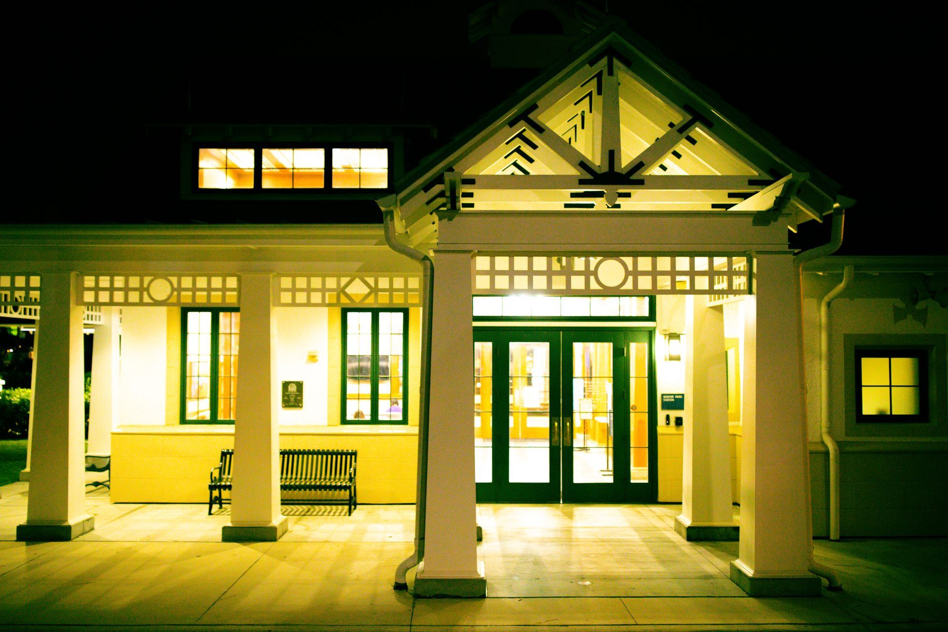 The front of a building with a porch at night