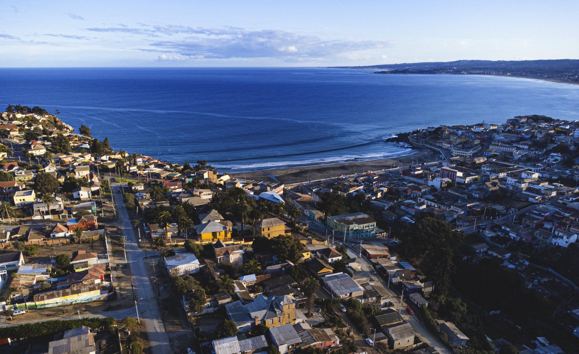 An aerial view of a city next to a body of water.