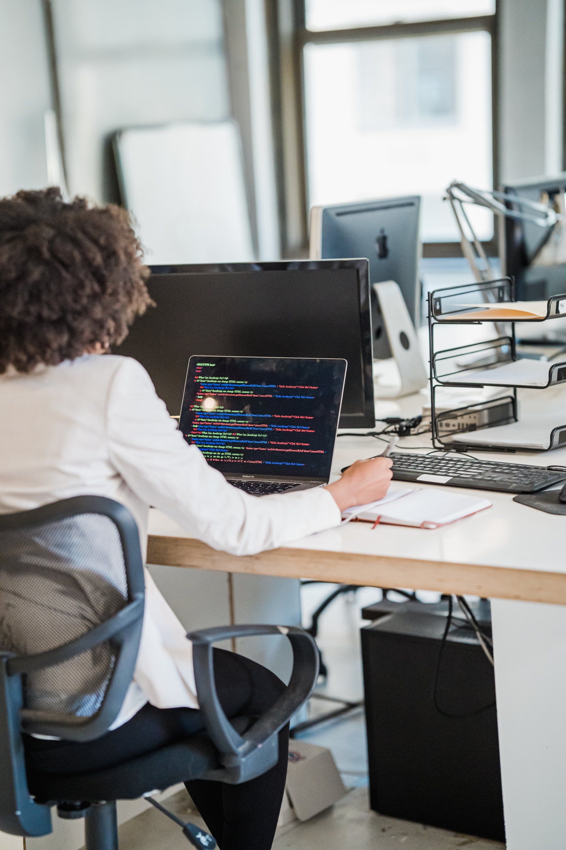 IT management employee working on laptop