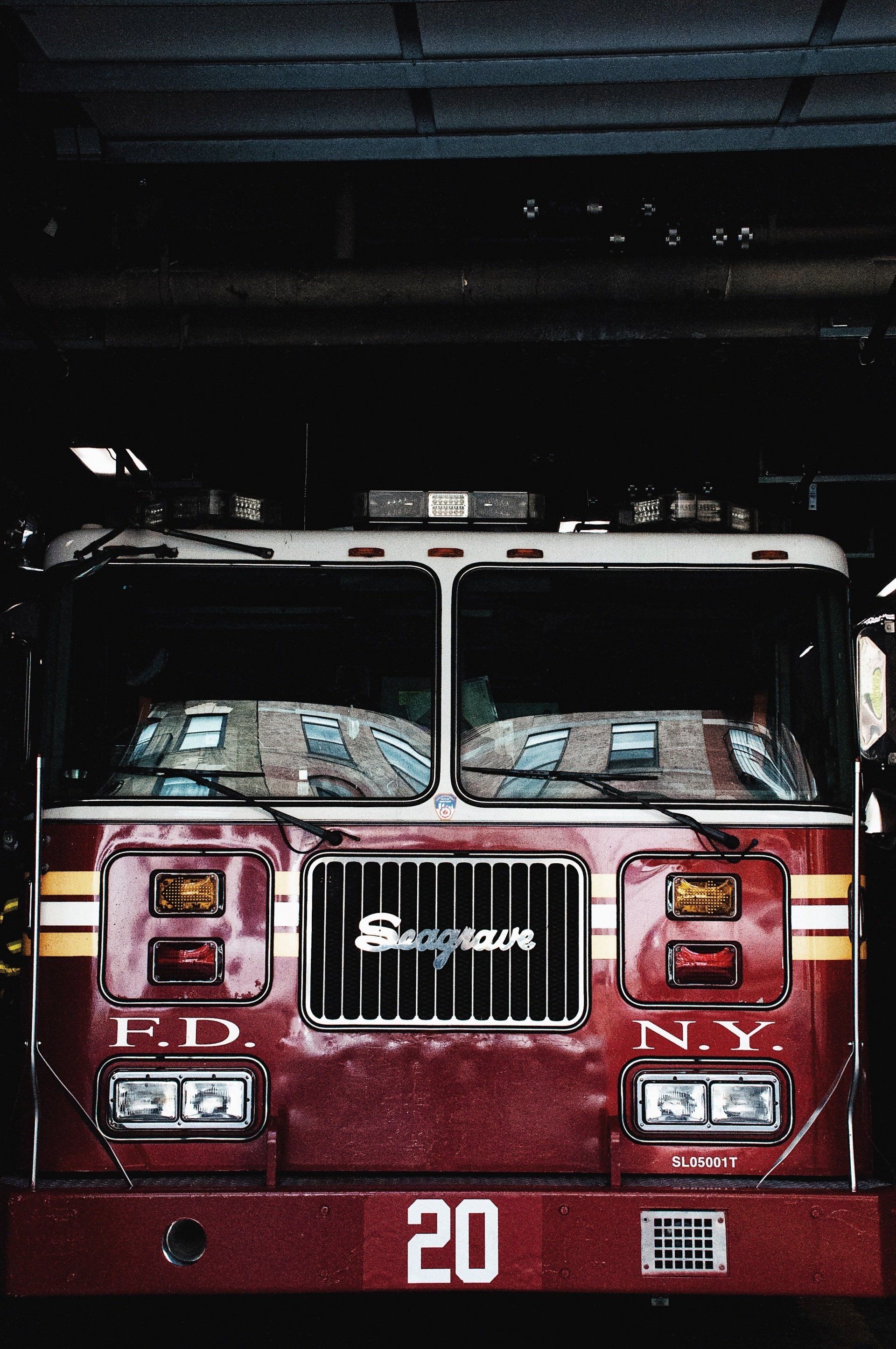 A red fire truck with the number 20 on the front
