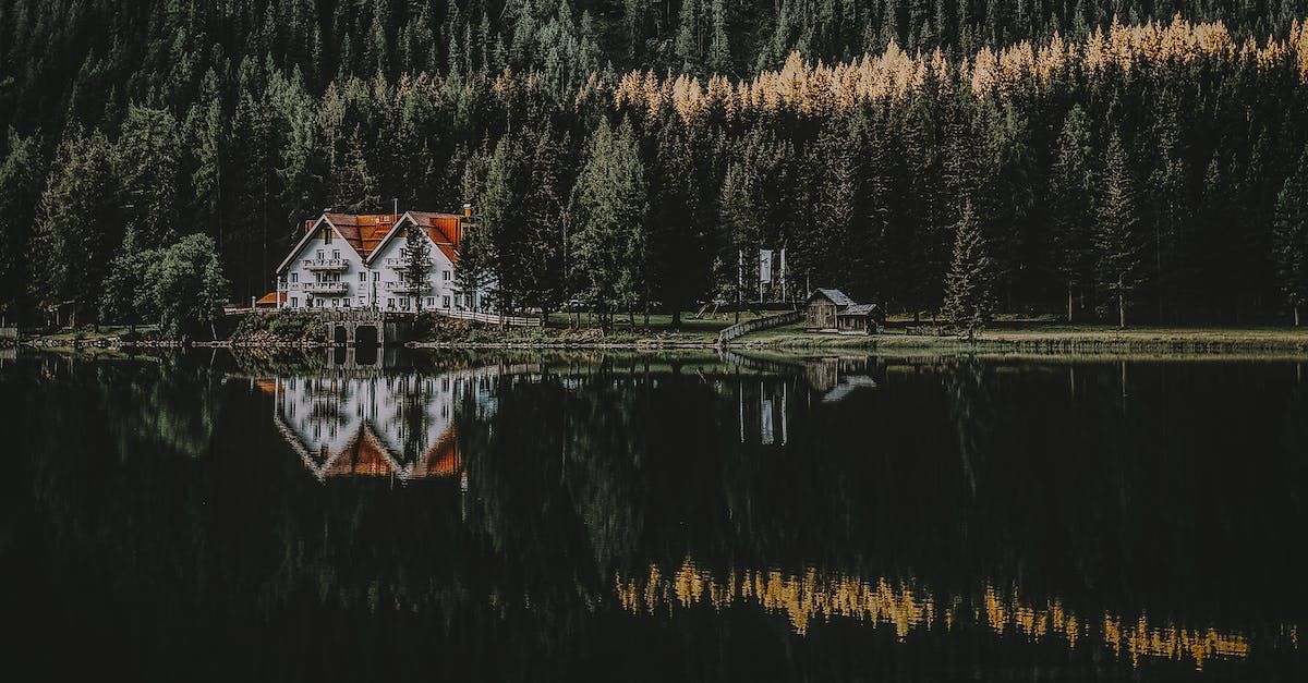 House on lake in forest