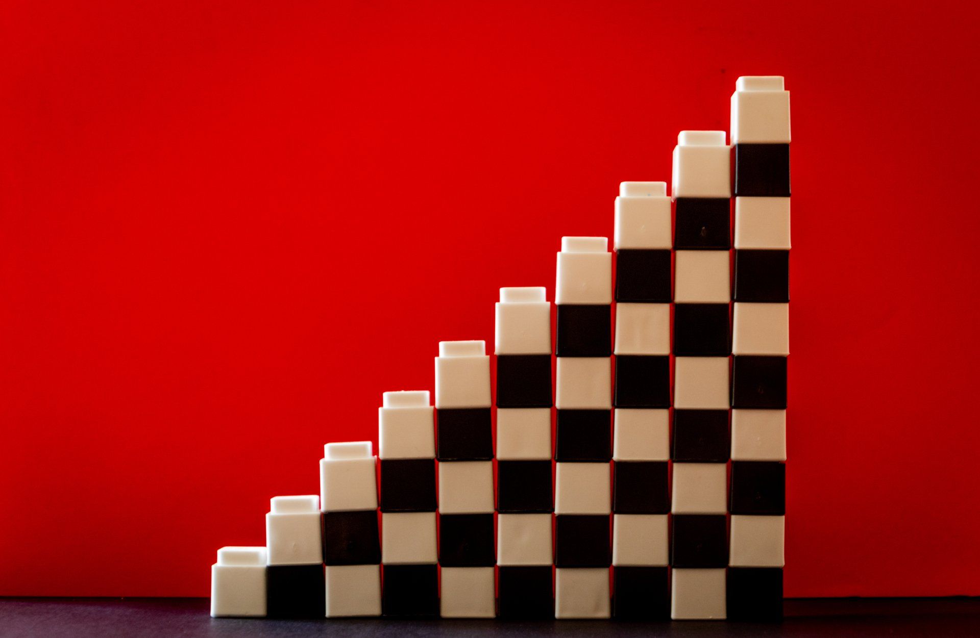 Black and white blocks stacked like a staircase to show organizational structure