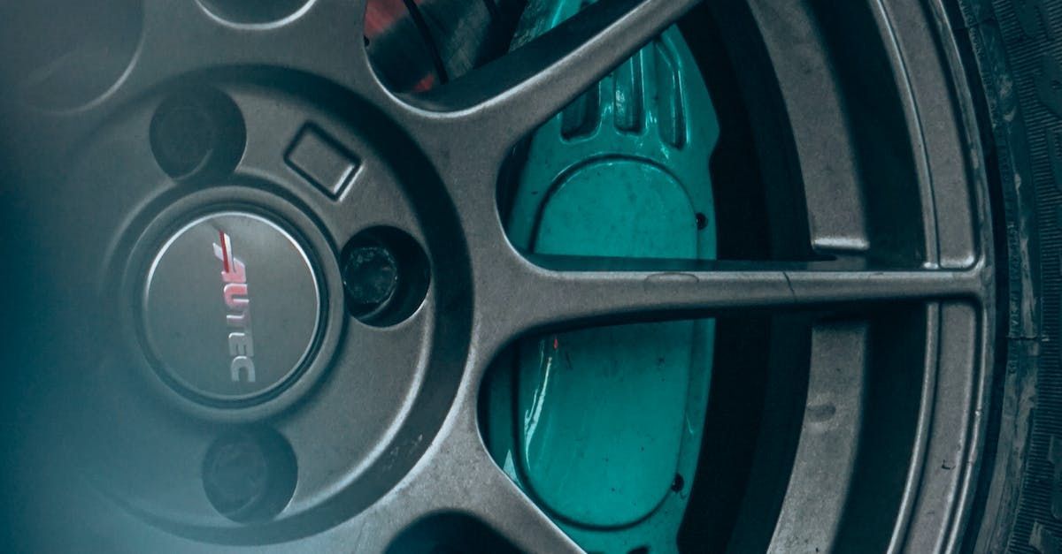 a close up of a car wheel with a blue brake caliper .