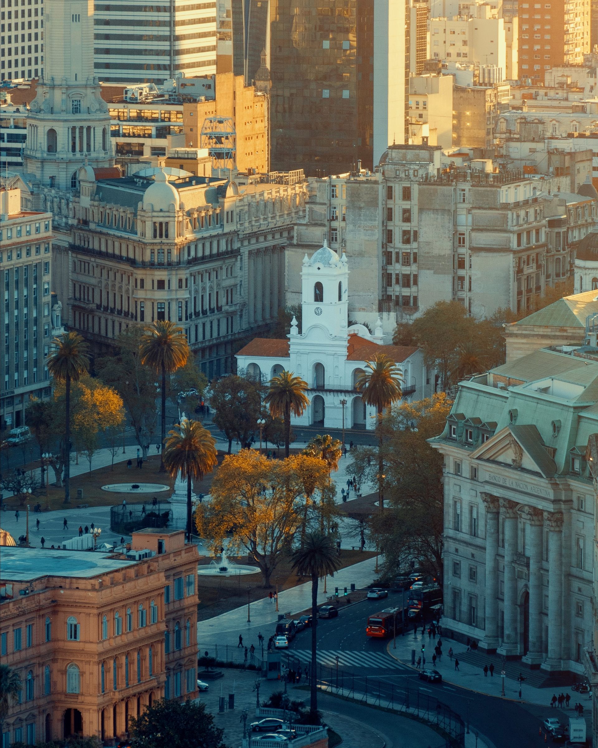 An aerial view of a city with lots of buildings and trees