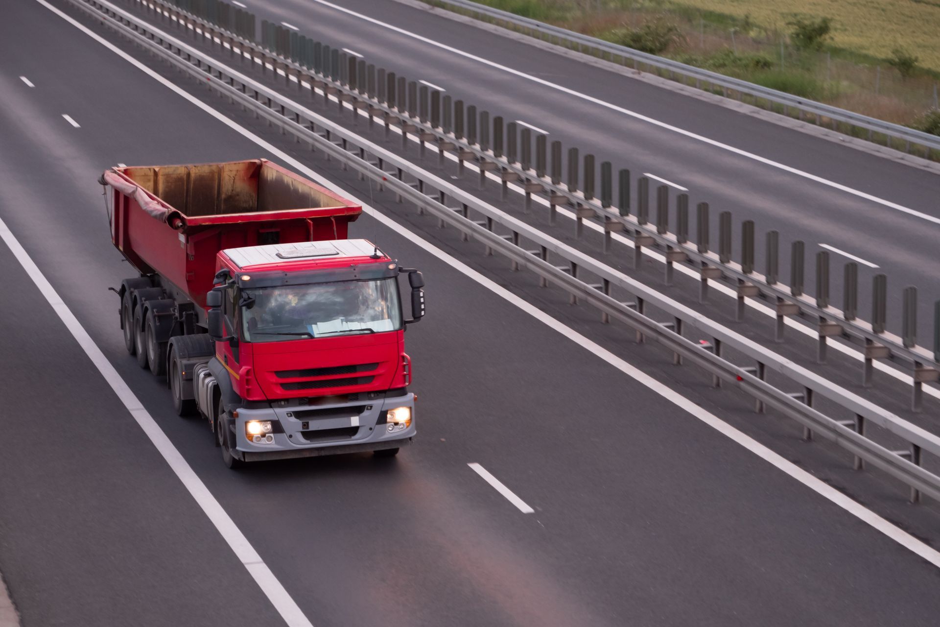 Red Hauling Truck On Road