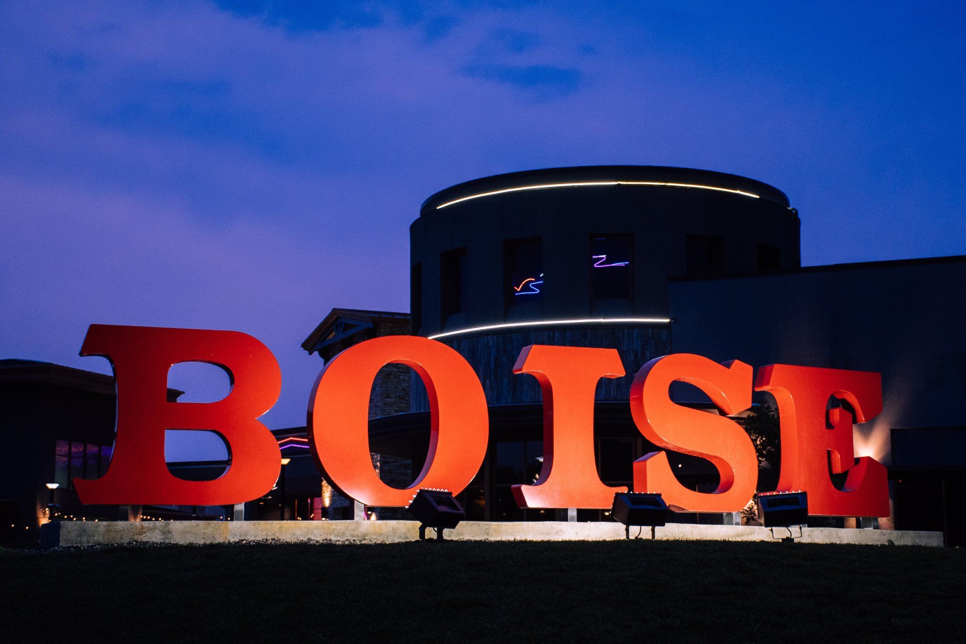 a large red sign that says boise in front of a building