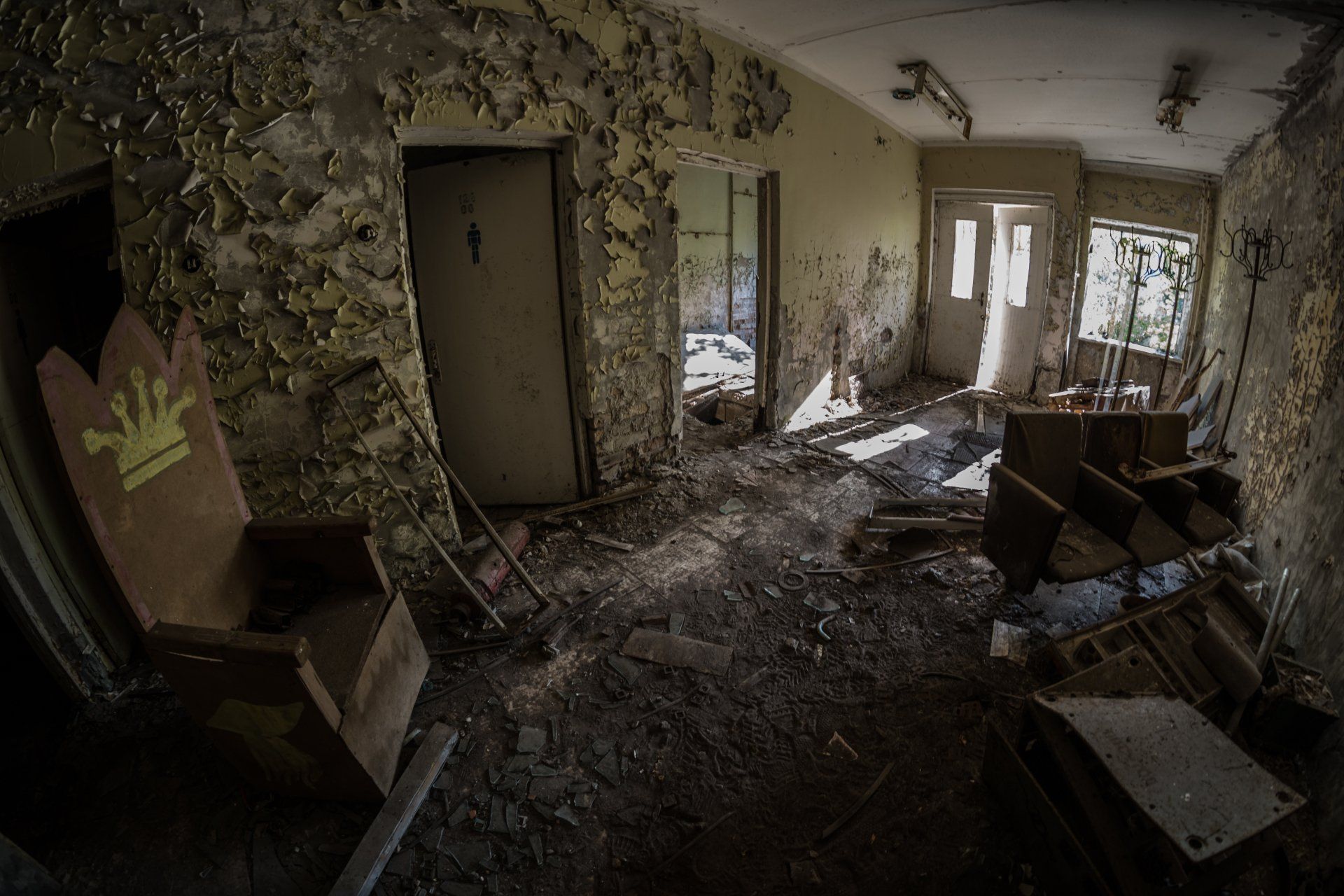 The inside of an abandoned home, destroyed on the inside, debris everywhere