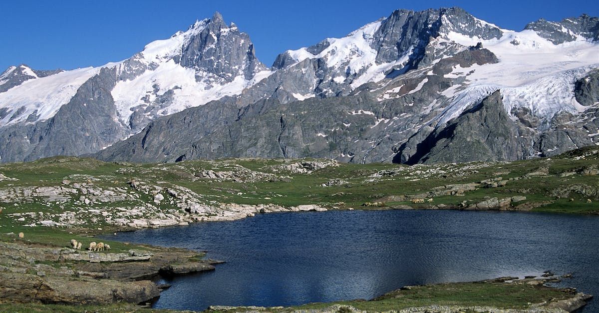 A pond in front of mountains in Zurich, Switzerland.
