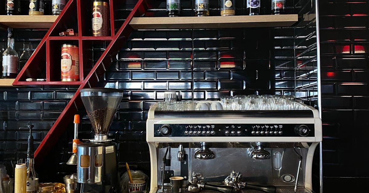 There is a coffee machine in the middle of the kitchen.