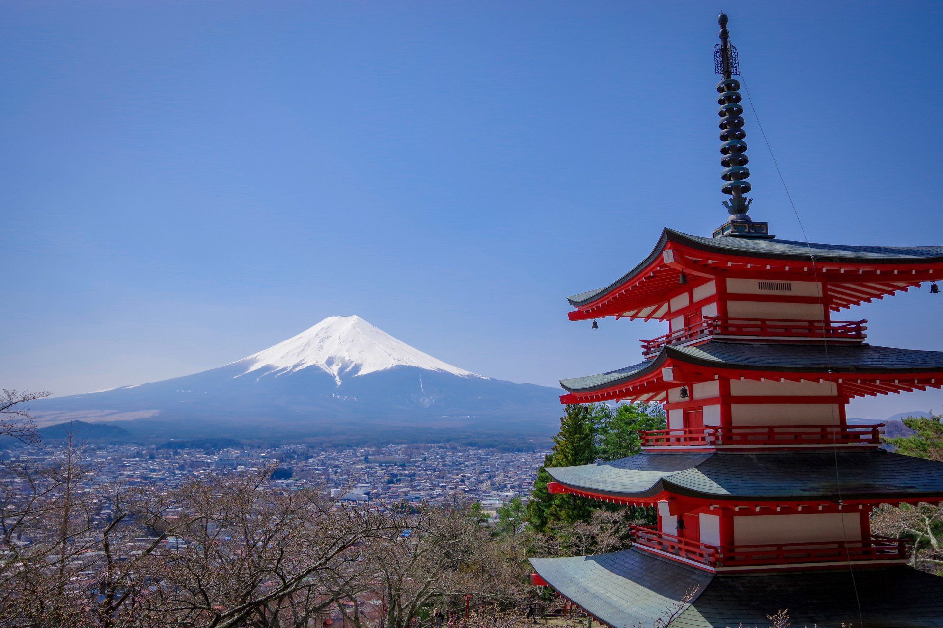 Mount Fiji in the distance with a Japanese building in the foreground