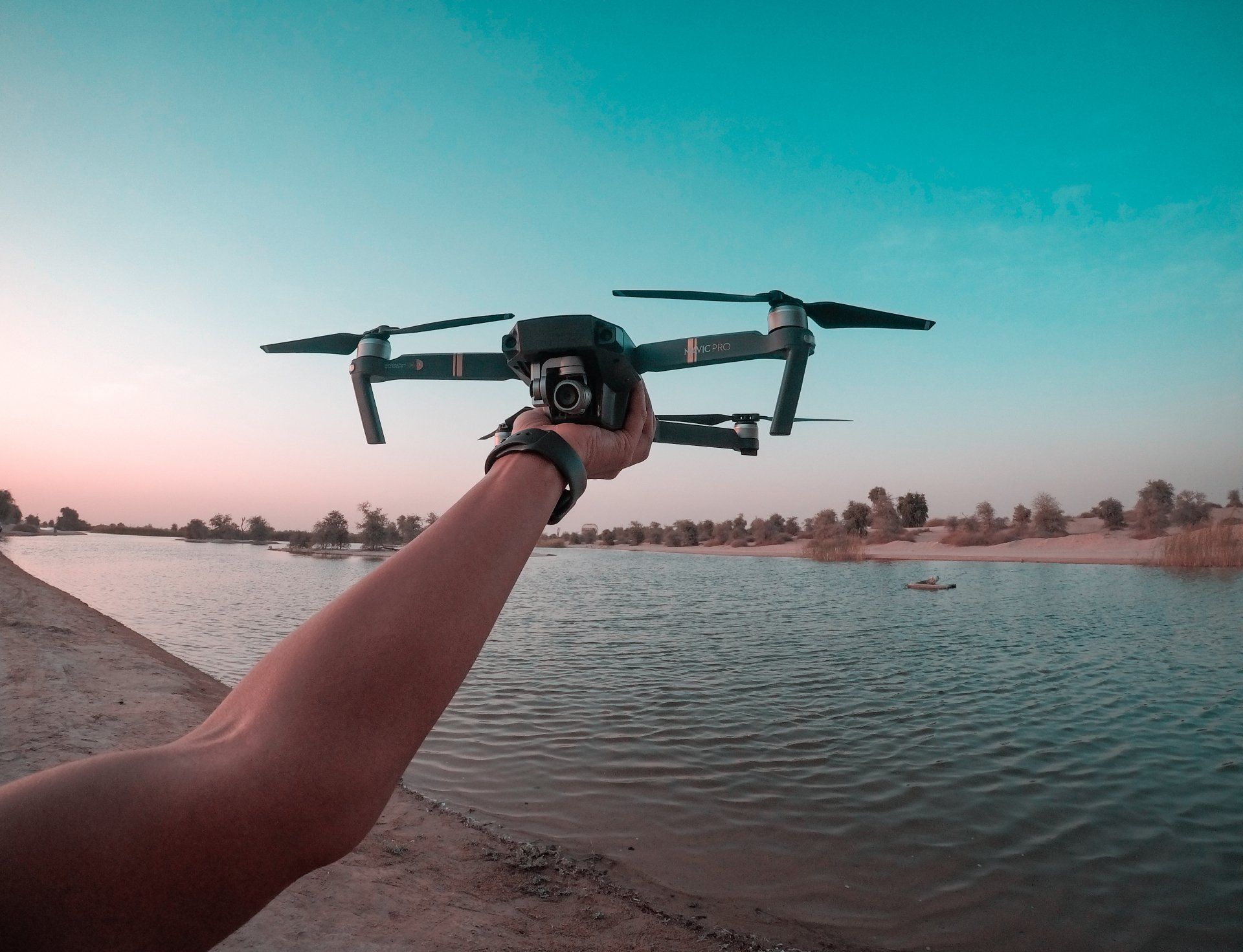 Drone being held over a beach scene