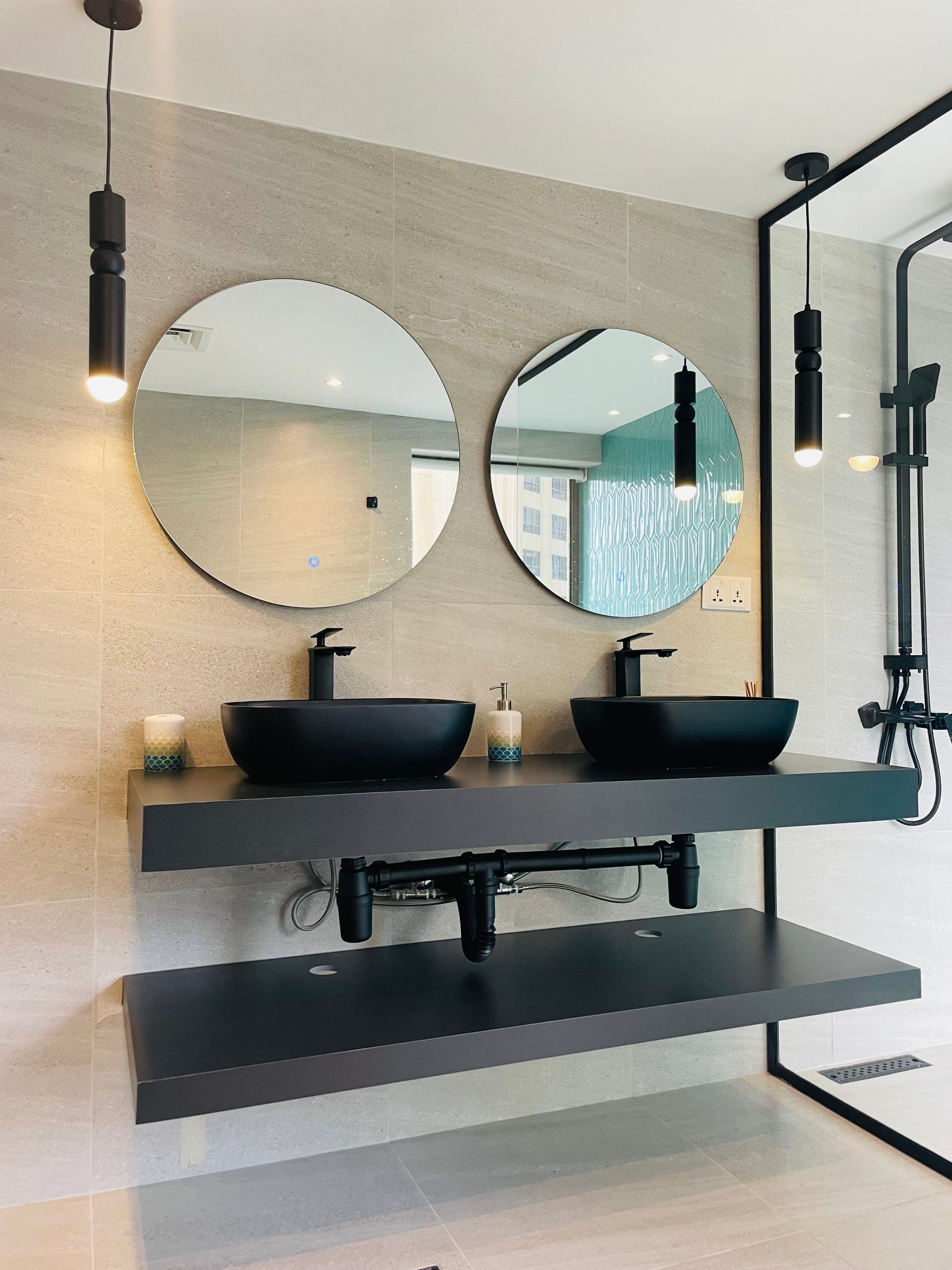 a bathroom with two sinks, two mirrors, and a shower. Bathroom Gut and Remodel Cost in 2024