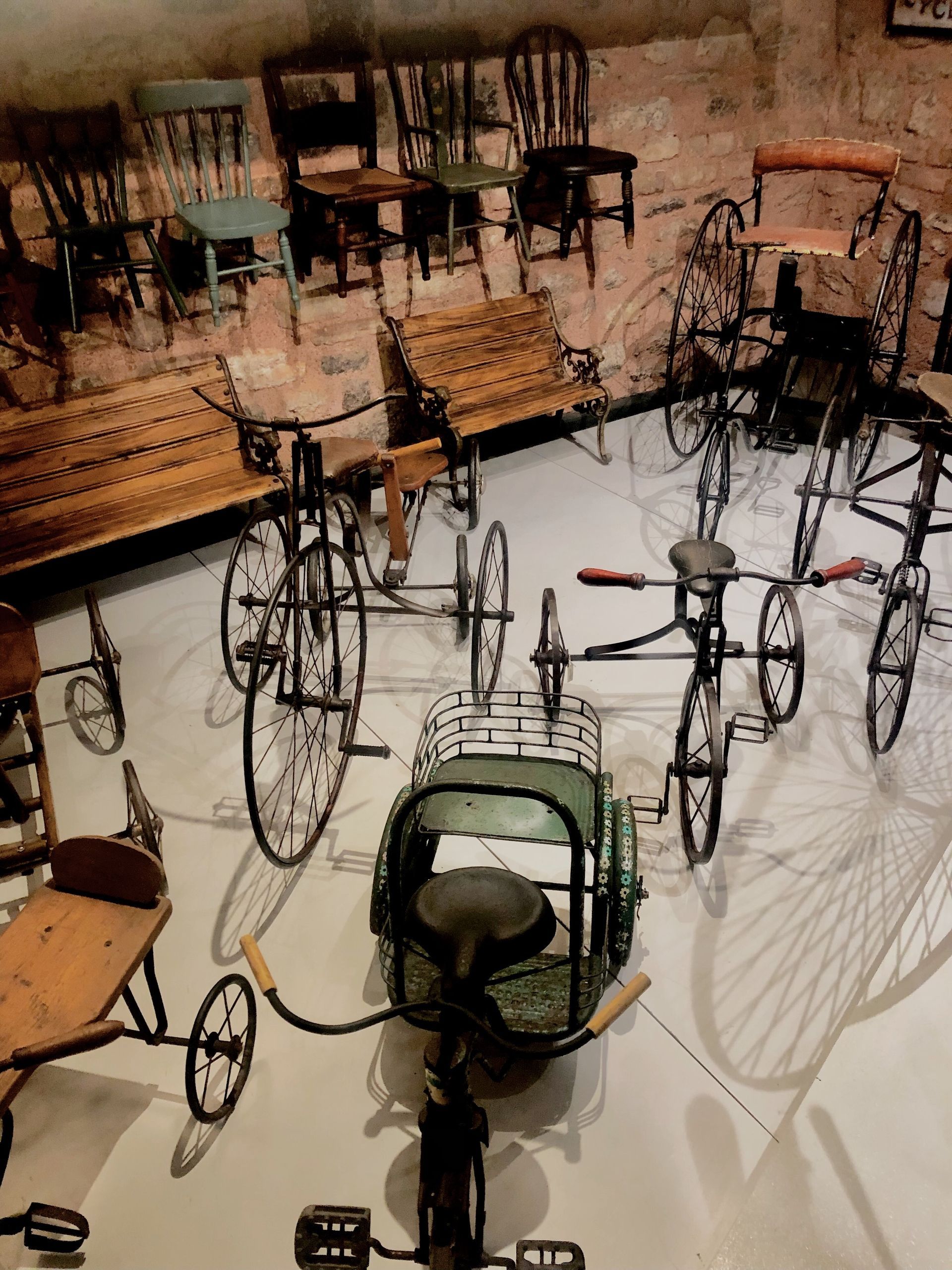 A group of bicycles are lined up in a room