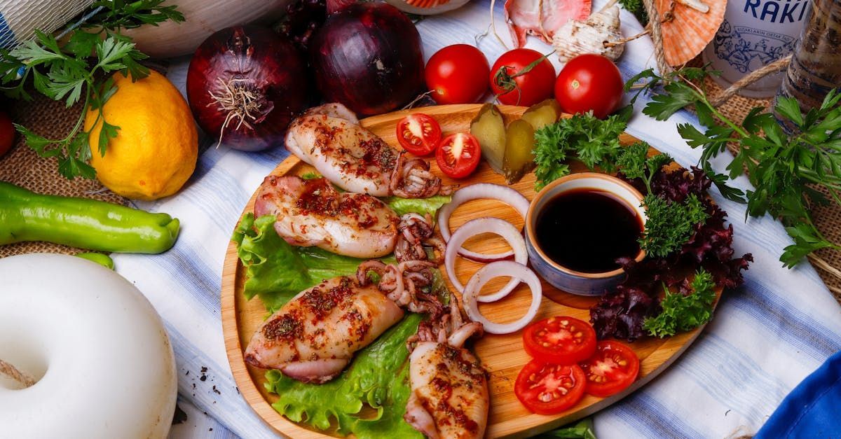A wooden plate topped with meat and vegetables on a table.