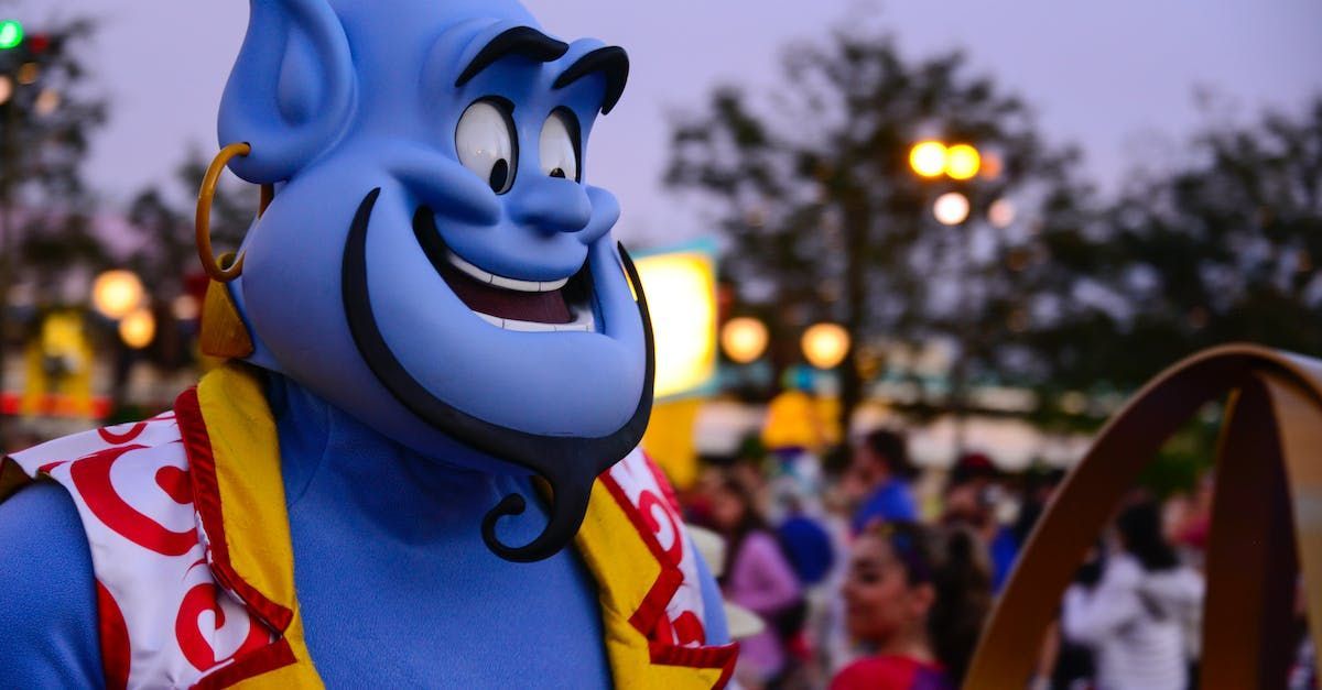 A close up of a genie mascot at a carnival.