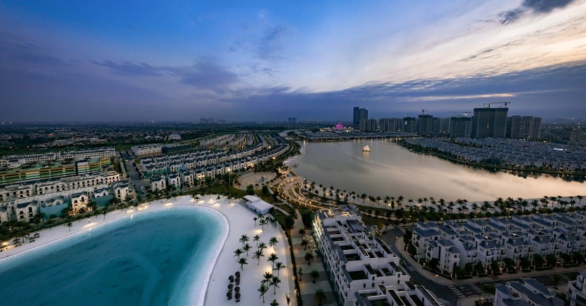 An aerial view of a city with a large body of water in the middle of it.