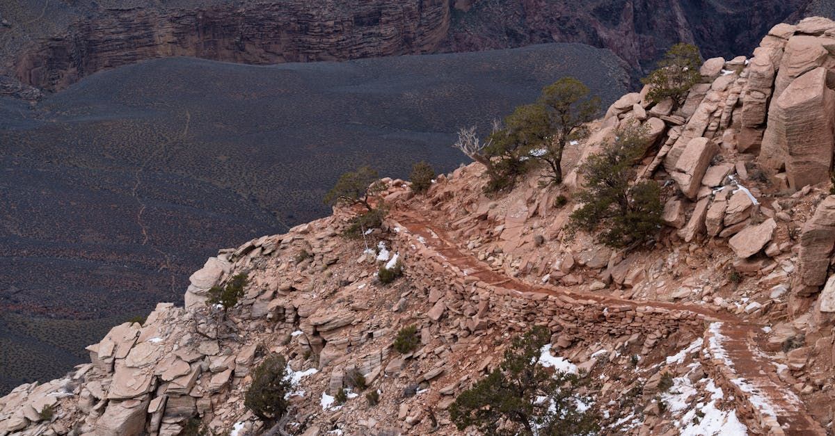 An aerial view of a trail on the side of a mountain.