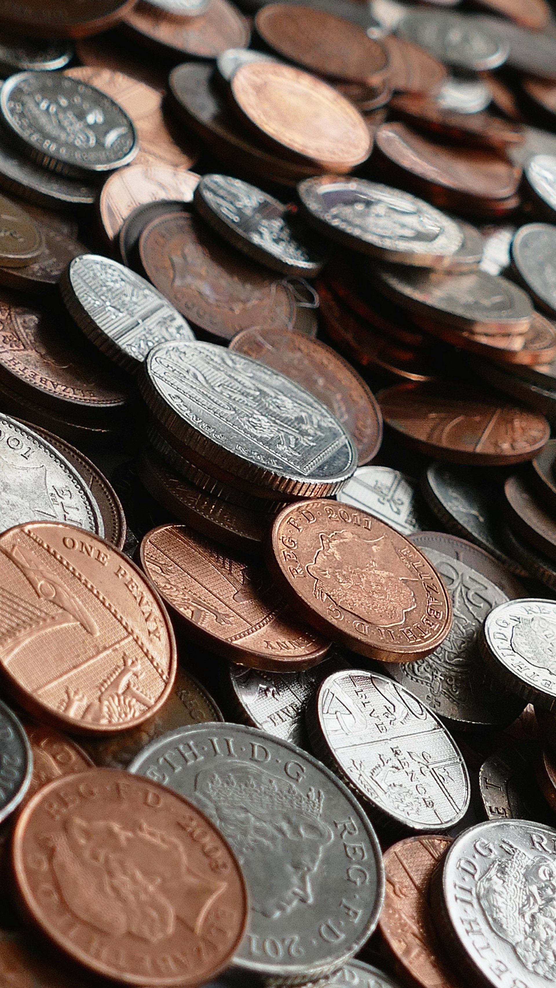 An image of a pile of Great British coins including 1ps, 2ps, 10ps and 20ps