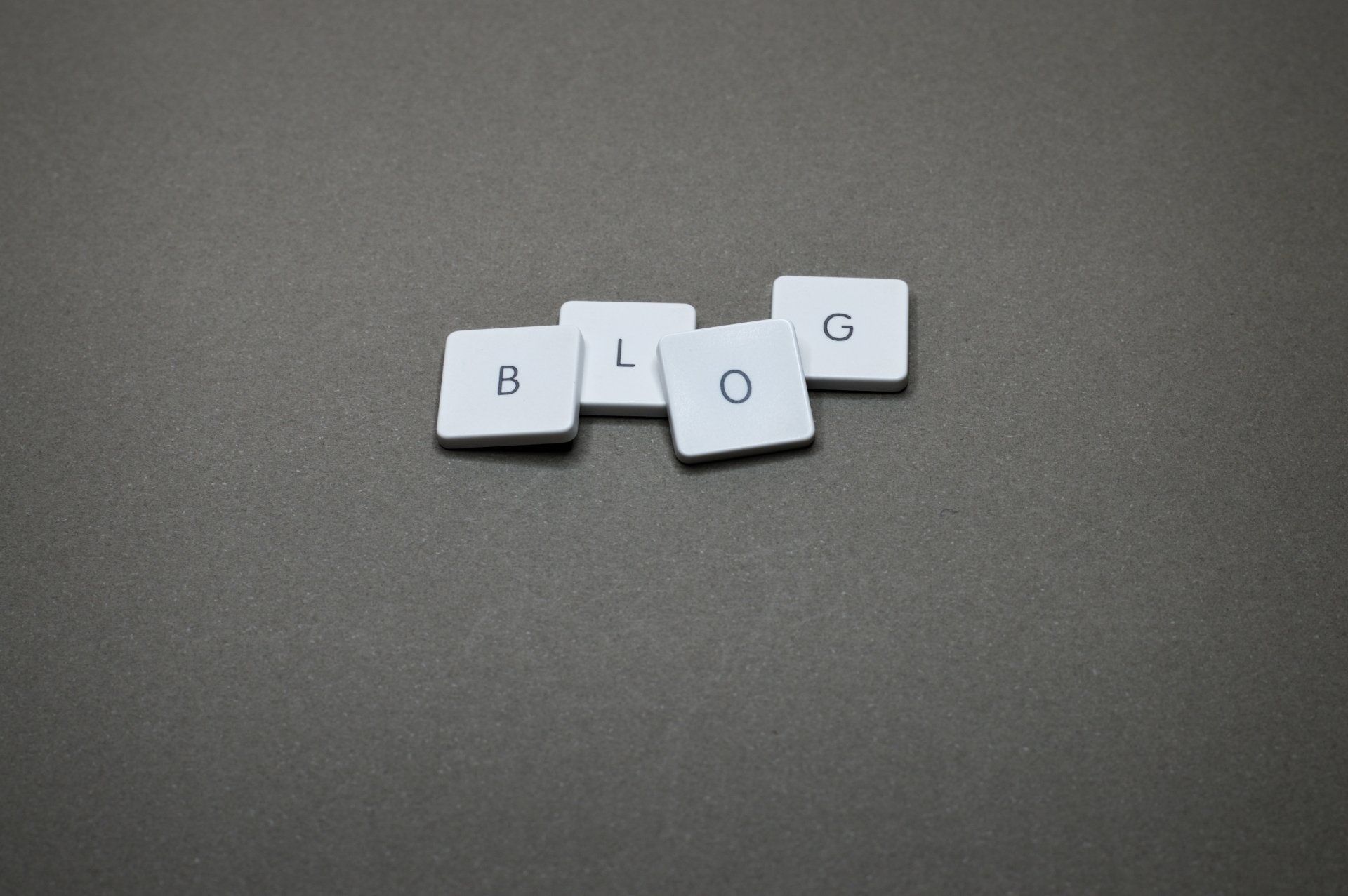 Image of 4 letter cards spelling out the word blog