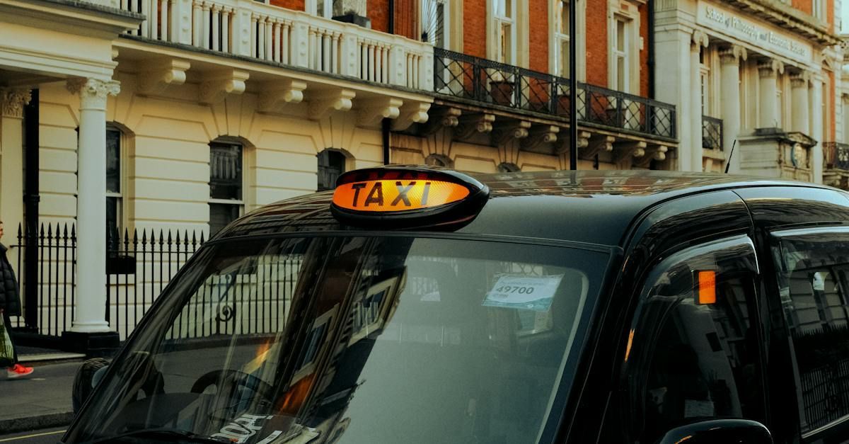 a black taxi is parked on the side of the road in front of a building 
