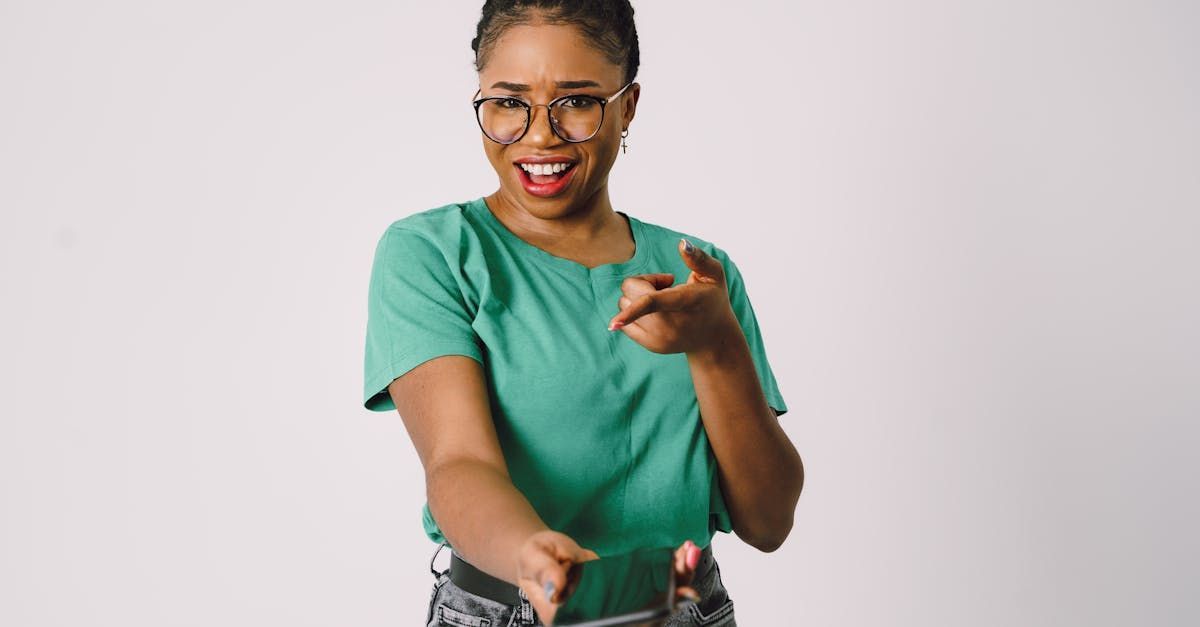 A young lady holding a phone out to the camera and pointing to it as if to say call now! Clicking this picture takes you to When Life Happens Call Christina Now!