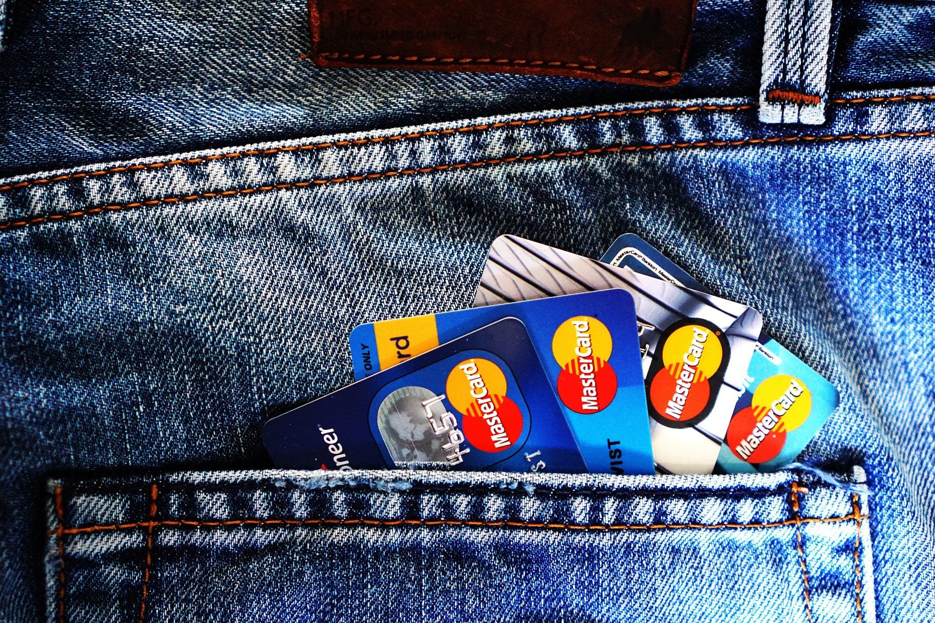 several credit cards are in the back pocket of a pair of jeans glenn hoch usa mortgage credit scores