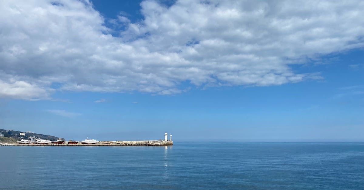 There is a lighthouse in the middle of the ocean.