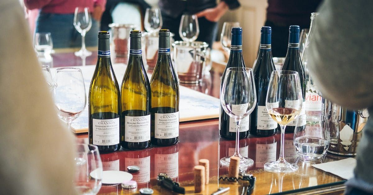 a row of wine glasses are lined up on a table .