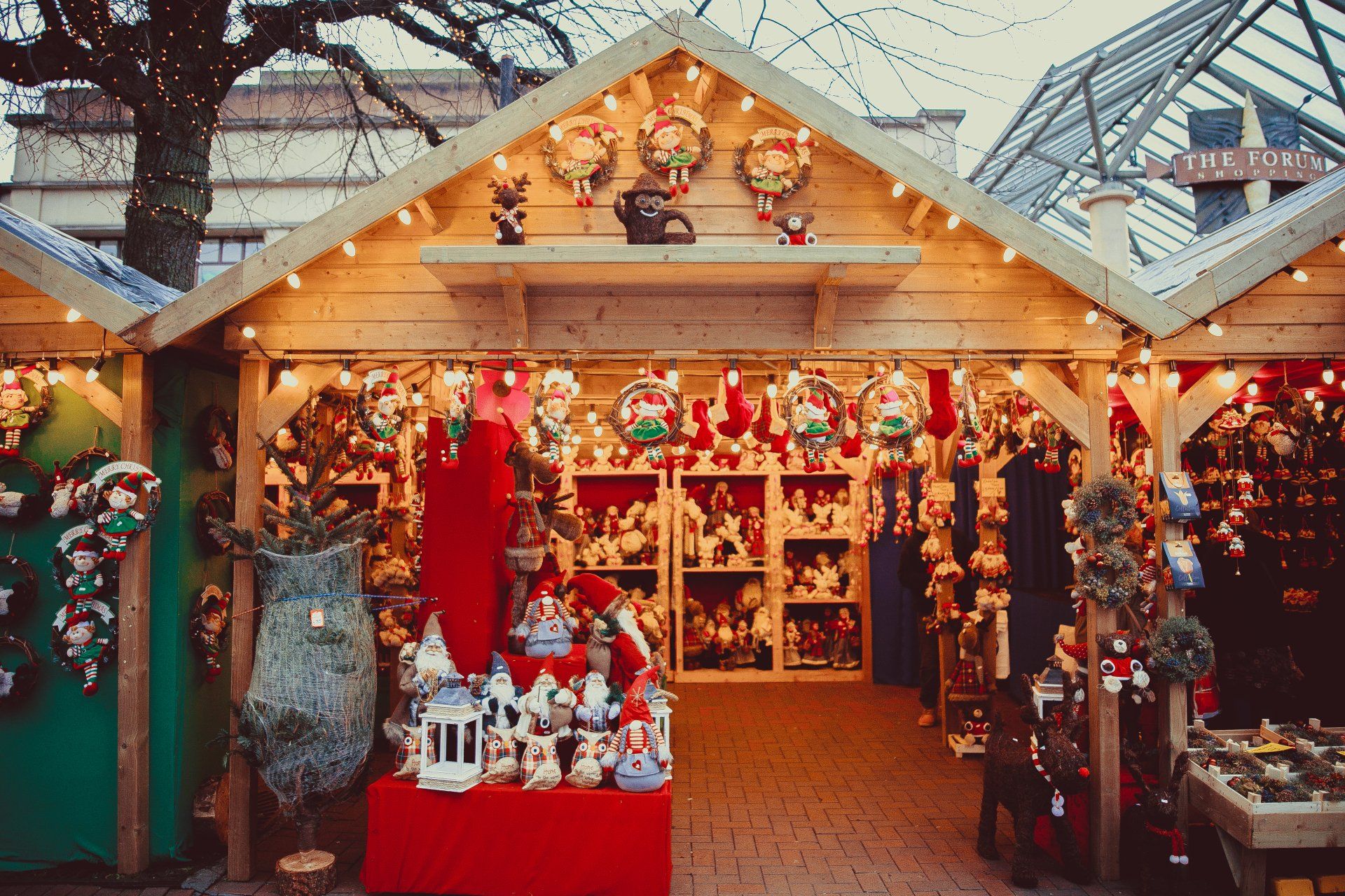 A christmas market with a lot of decorations on display.