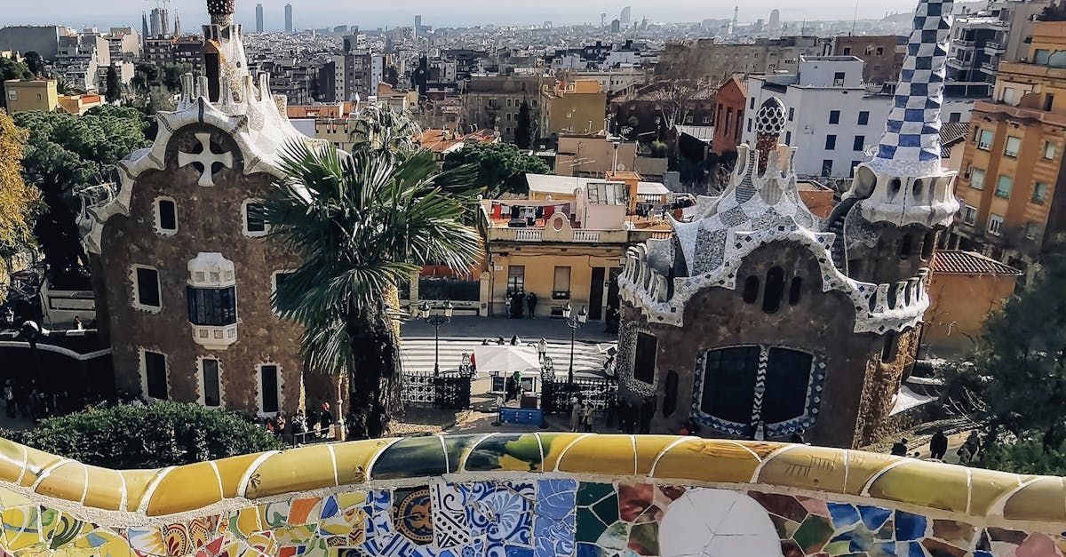 A view of a city from a balcony with buildings in the background