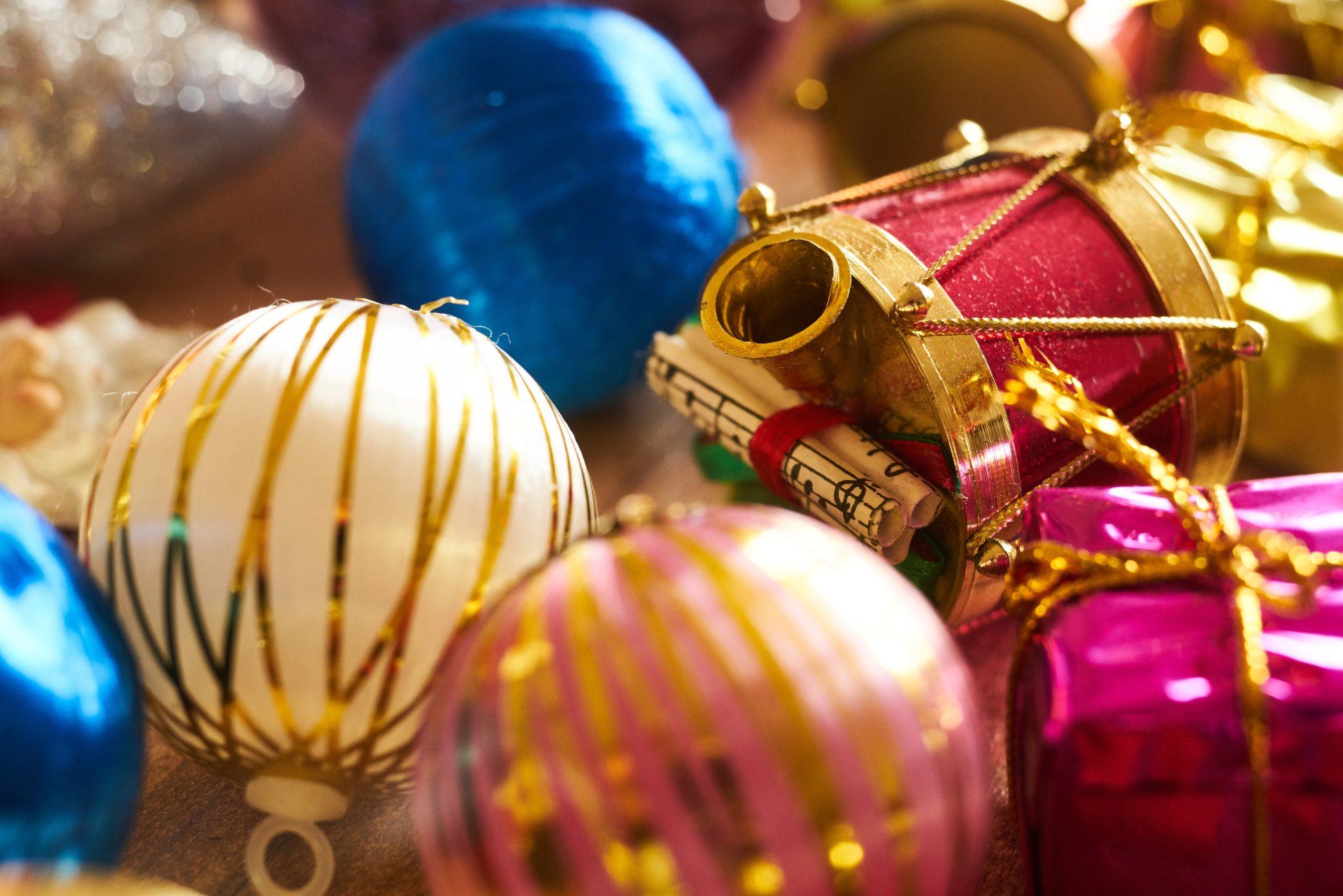 A pile of Christmas baubles in various colours.
