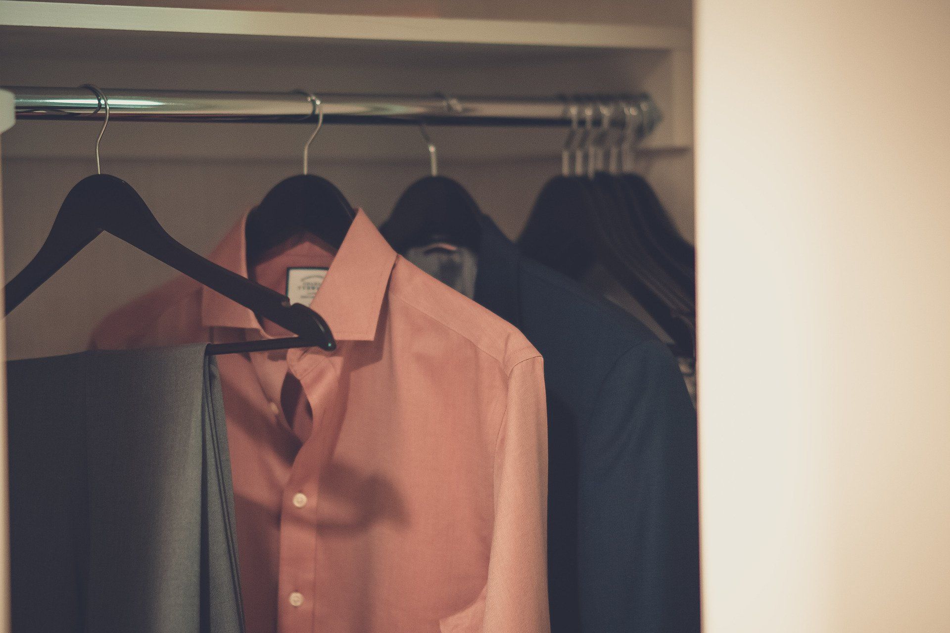 photo of clothing hanging in a closet