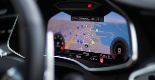 a close up of a car dashboard with a map on it .