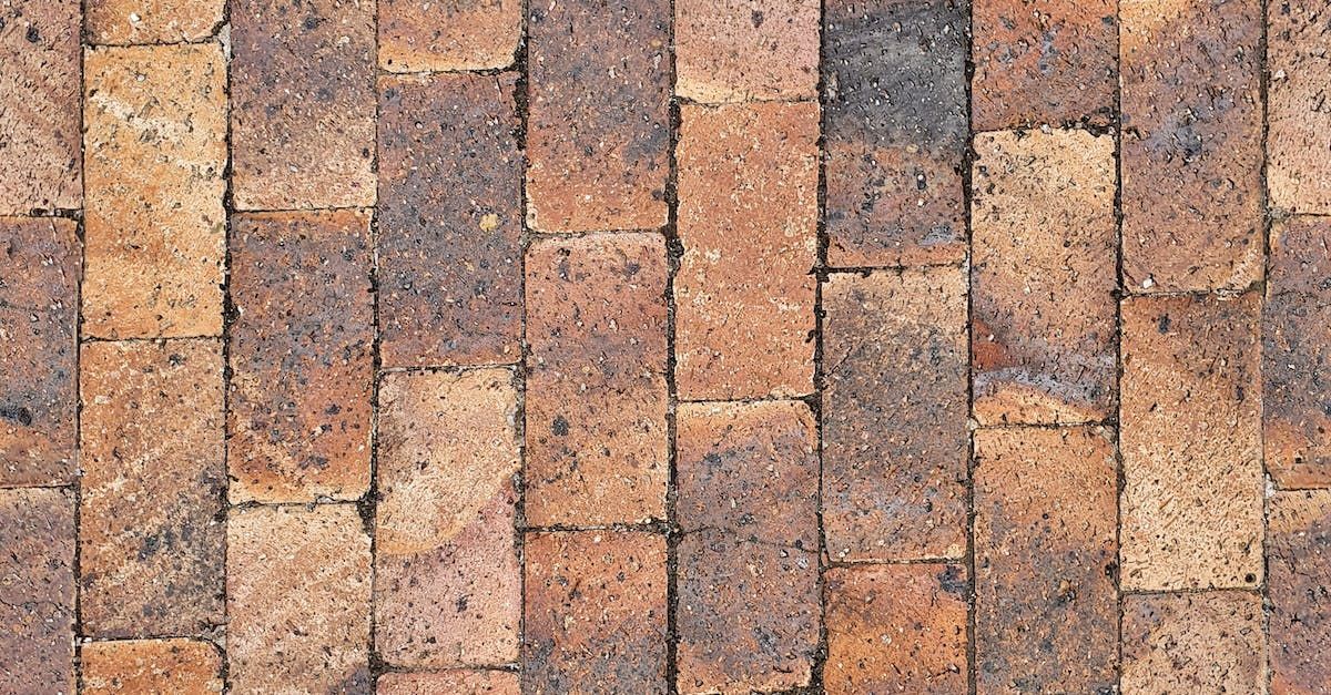 A close up of a brick wall with bricks lined up in a row.