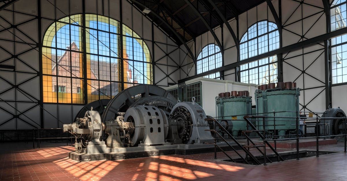 A large building with a lot of windows and a machine inside of it.