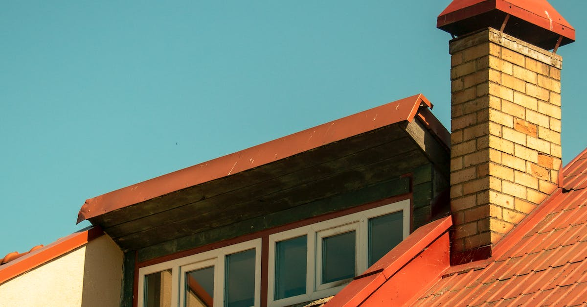 A brick chimney on the roof of a house