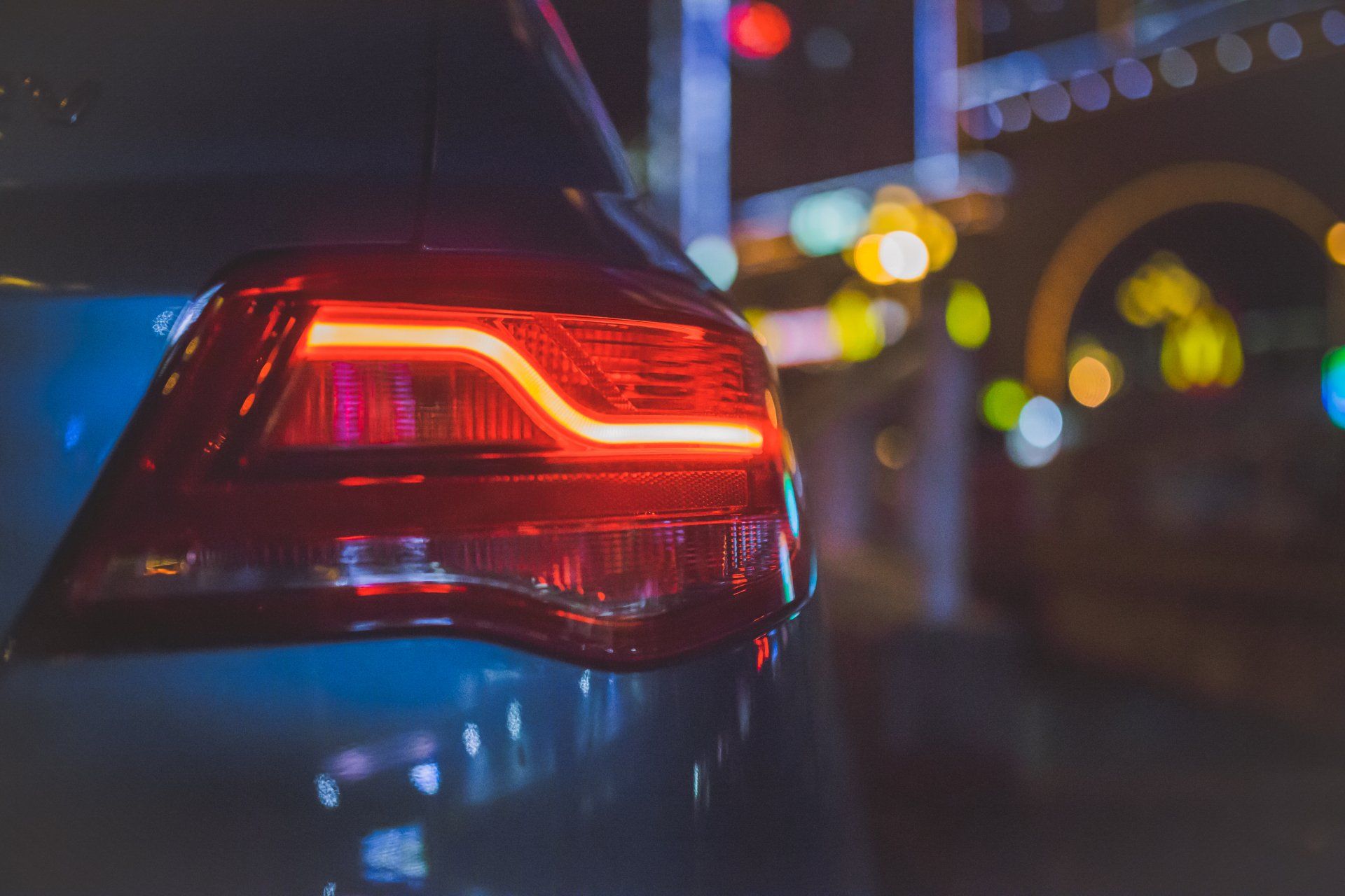 a close up of a car 's tail light at night