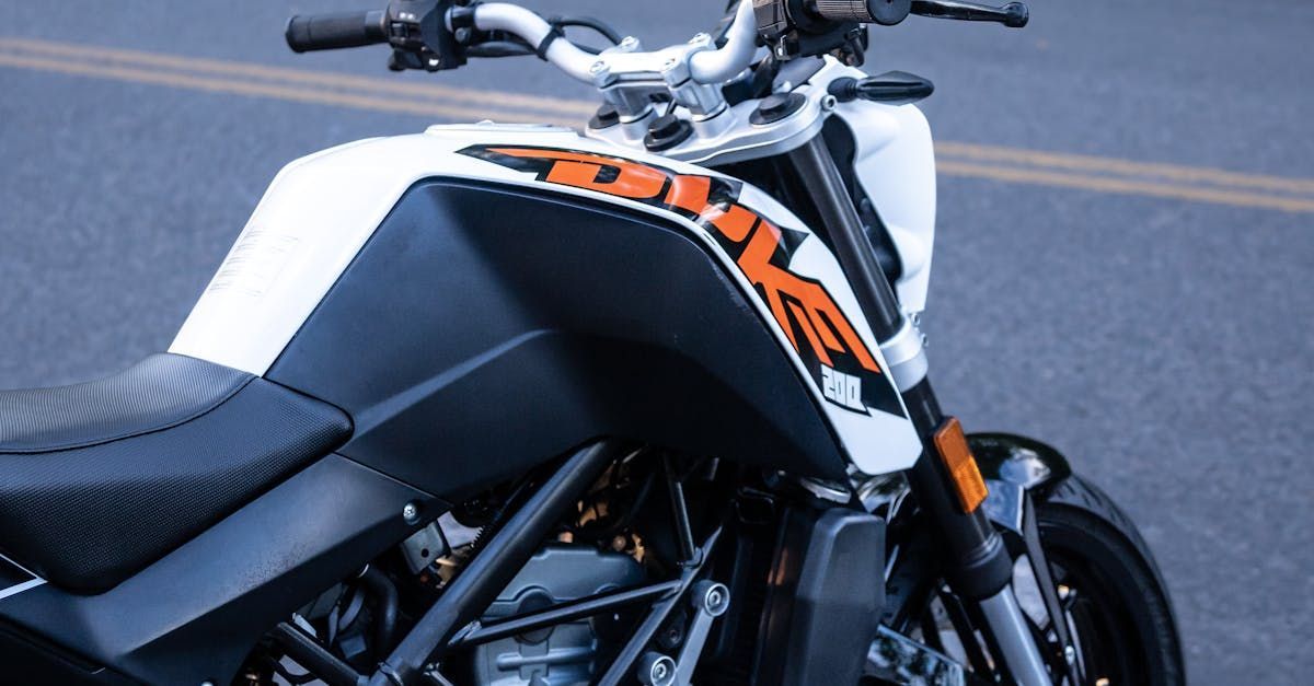 A black and white motorcycle is parked on the side of the road.