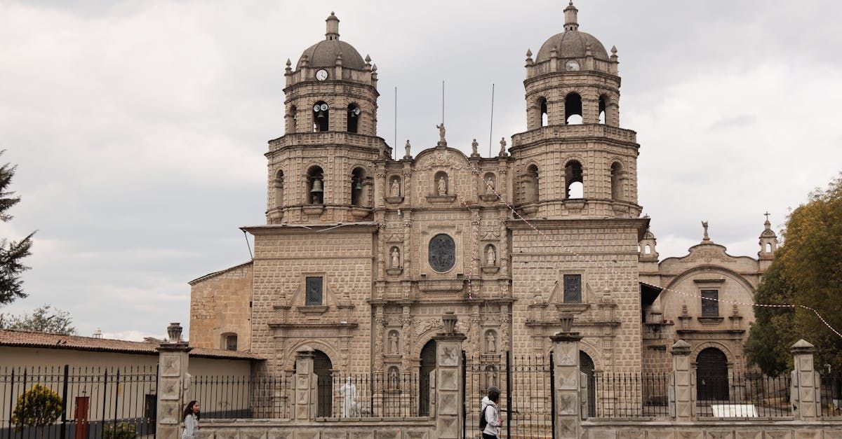 A large brick building with a dome on top of it. in Quito