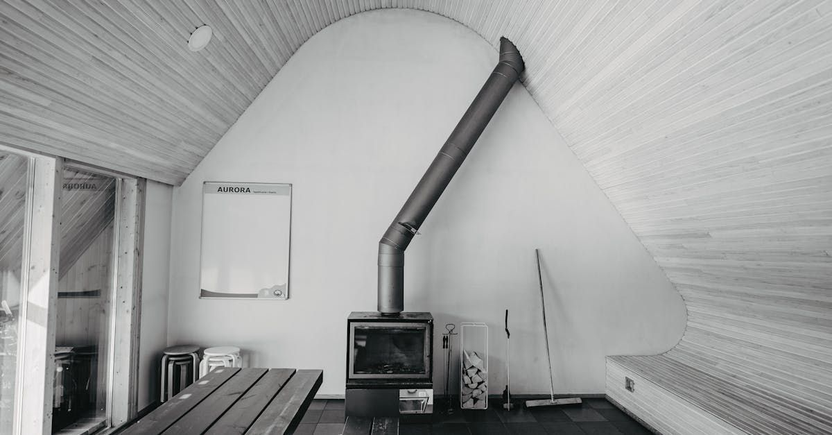 A black and white photo of a room with a fireplace and a table.