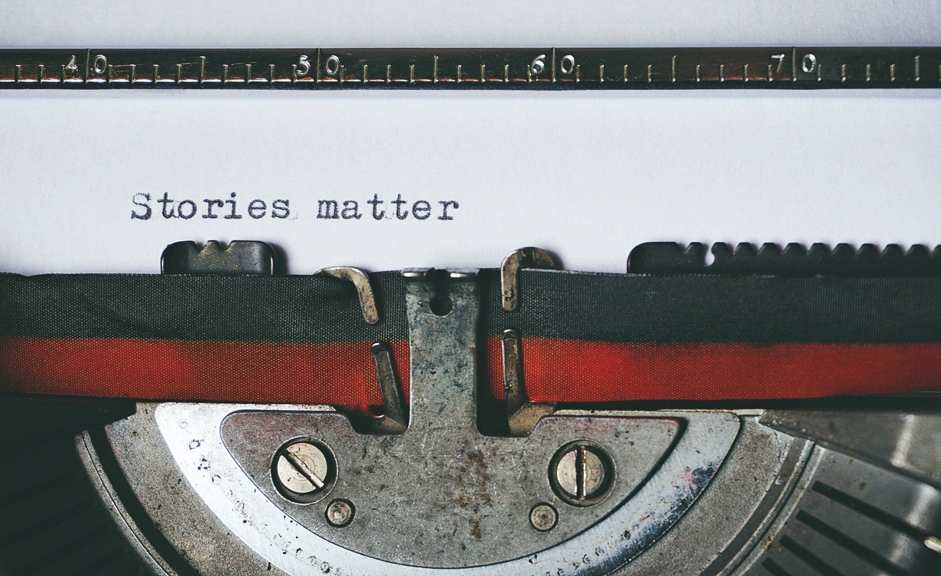 A typewriter with the words stories matter written on it